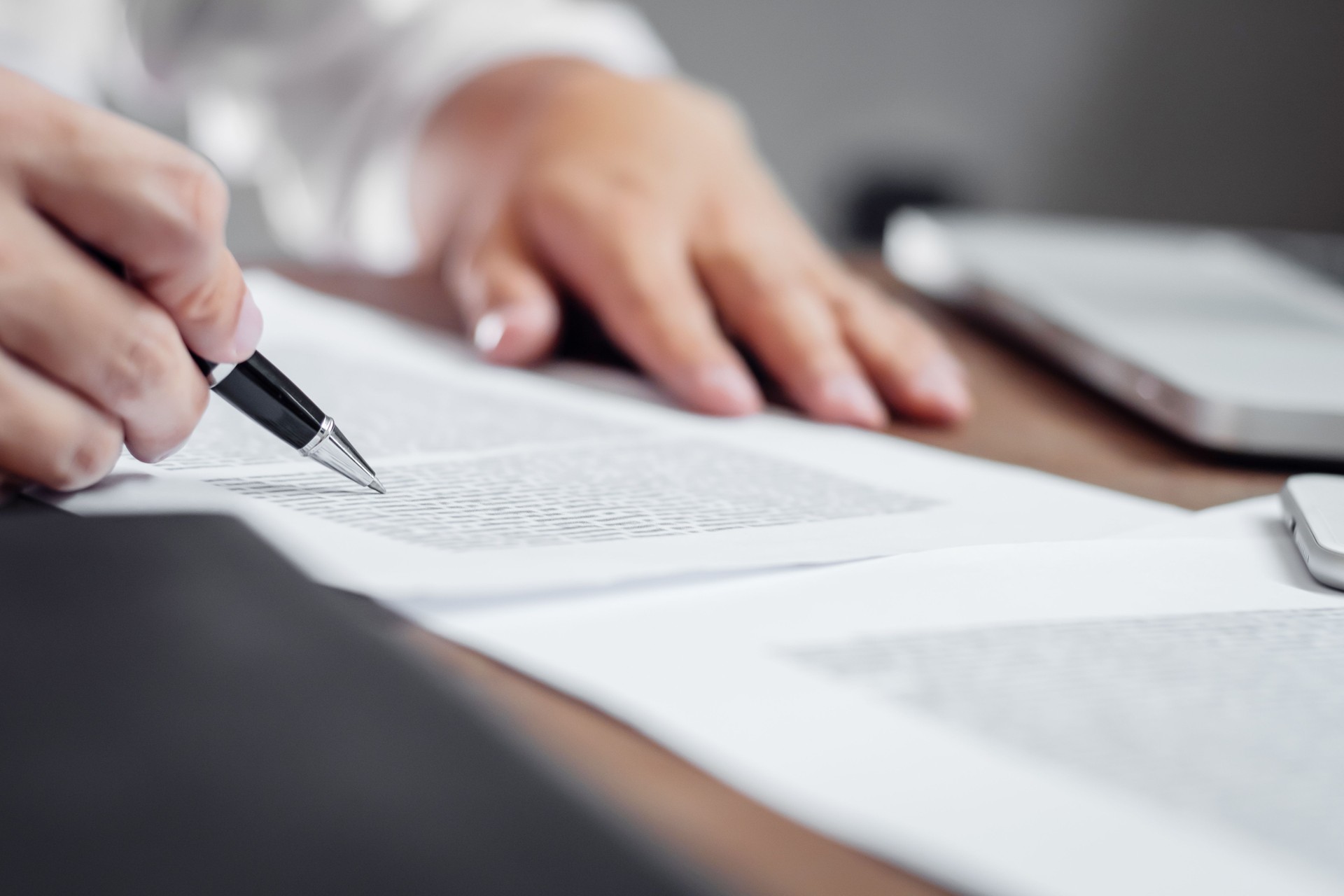 Insurance agent checking policy documents in office.